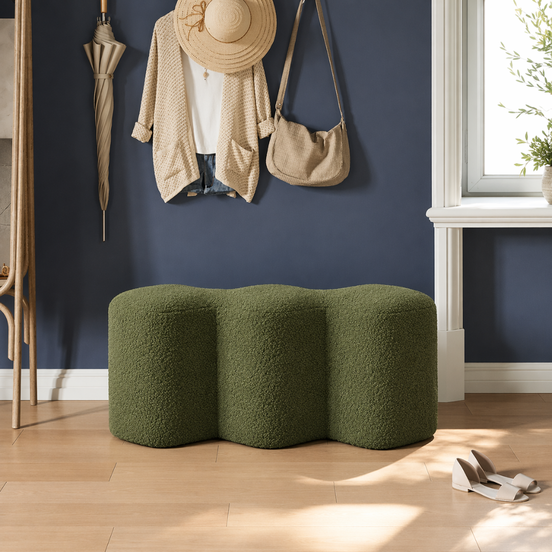 Cloud triple-curve boucle bench in an entryway below coat hooks