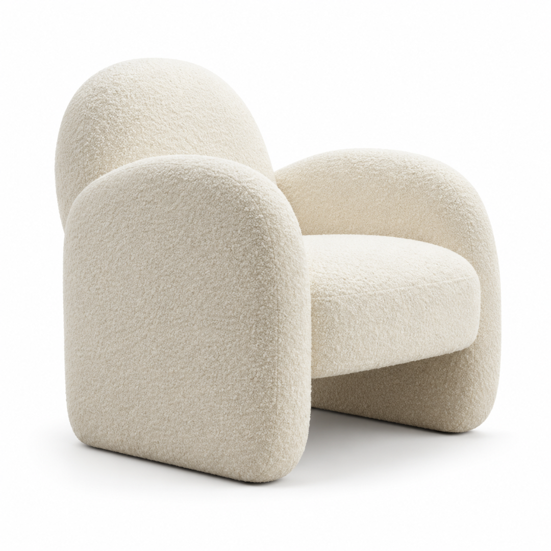 Angled view of the Locus boucle armchair showing the sculptural arms and arched back