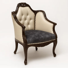 Decorative armchair with cream leather and dark wood frame on a white background