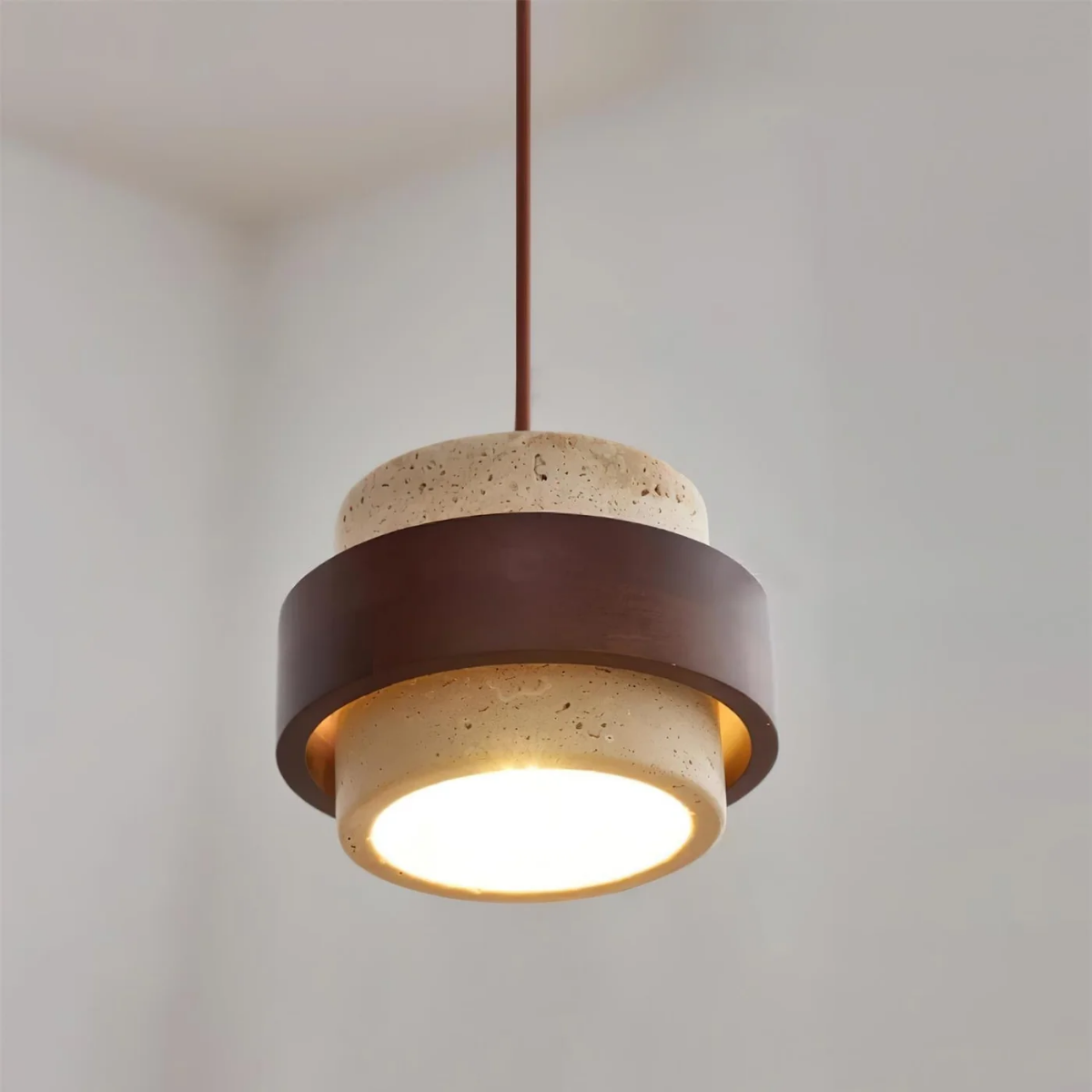 lifestyle bedroom corner with TerraHalo pendant lit near bedside furniture