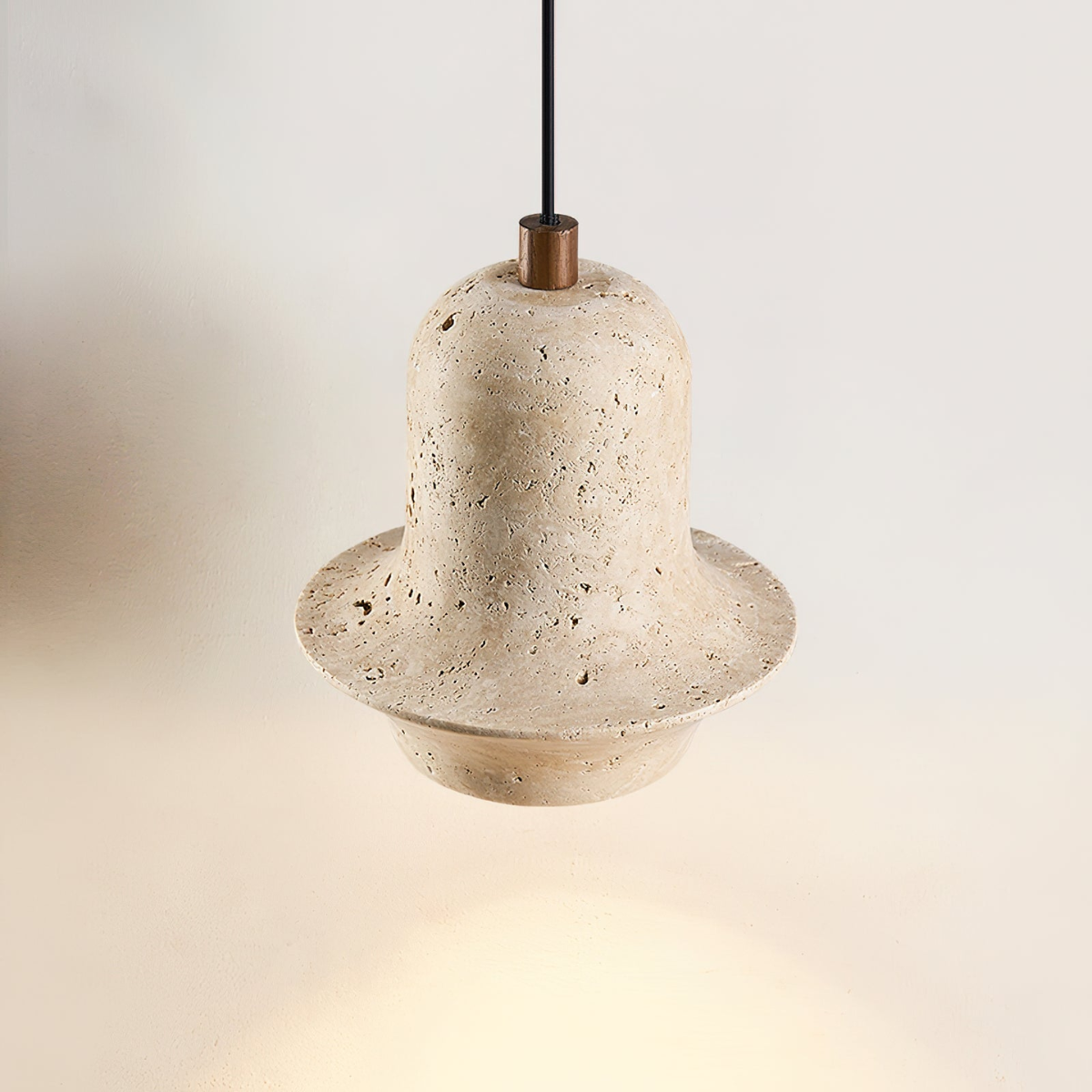 Bellora Sculpted Travertine Pendant Light - close-up angled view, lit