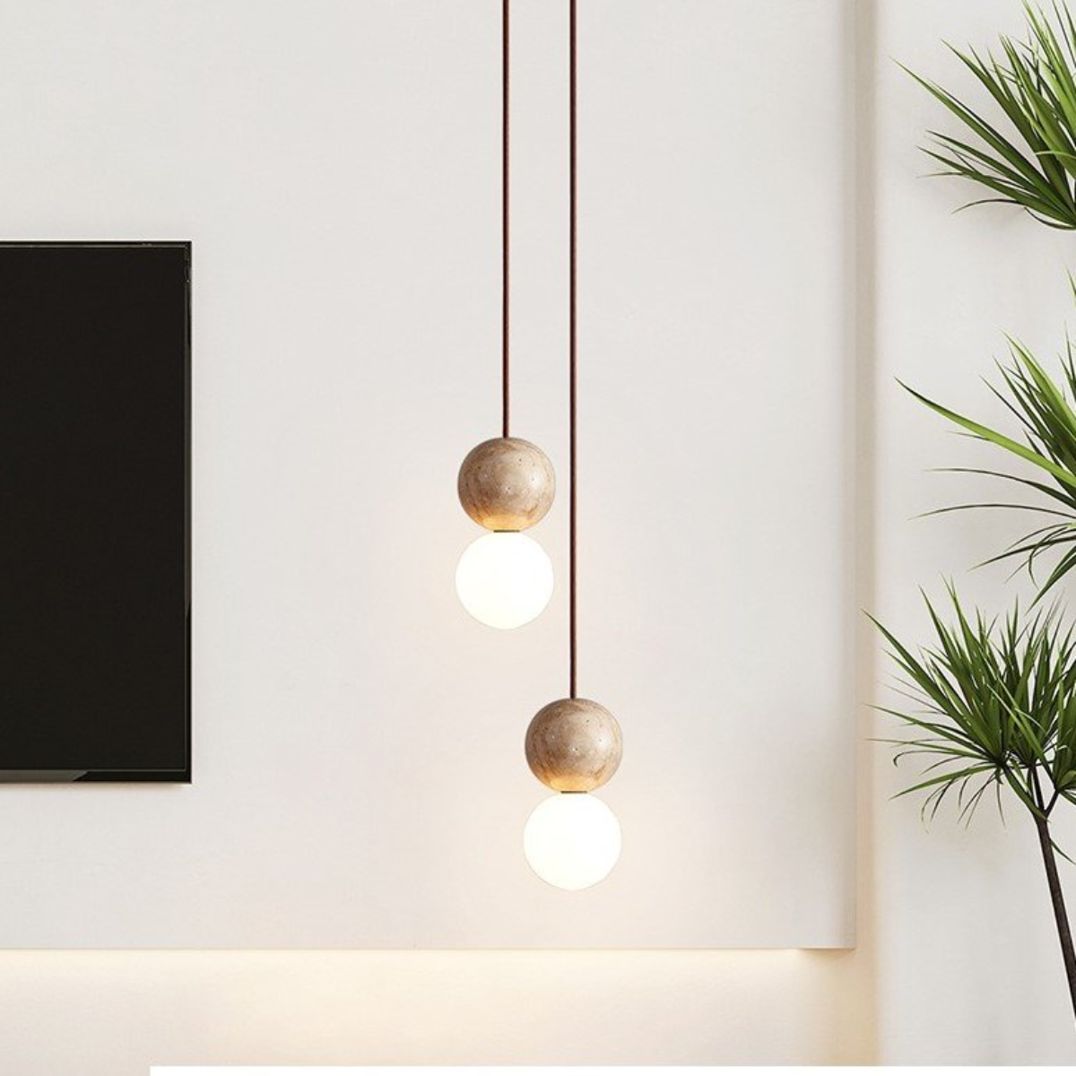 Mia Orb Pendant Light Natural - lifestyle in a living room near a TV and plant