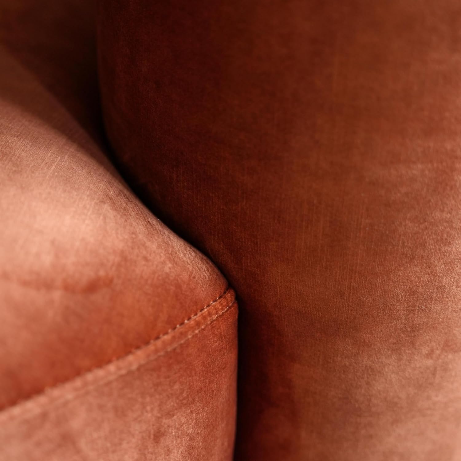 Close-up of brown velvet fabric with a focus on texture and color.