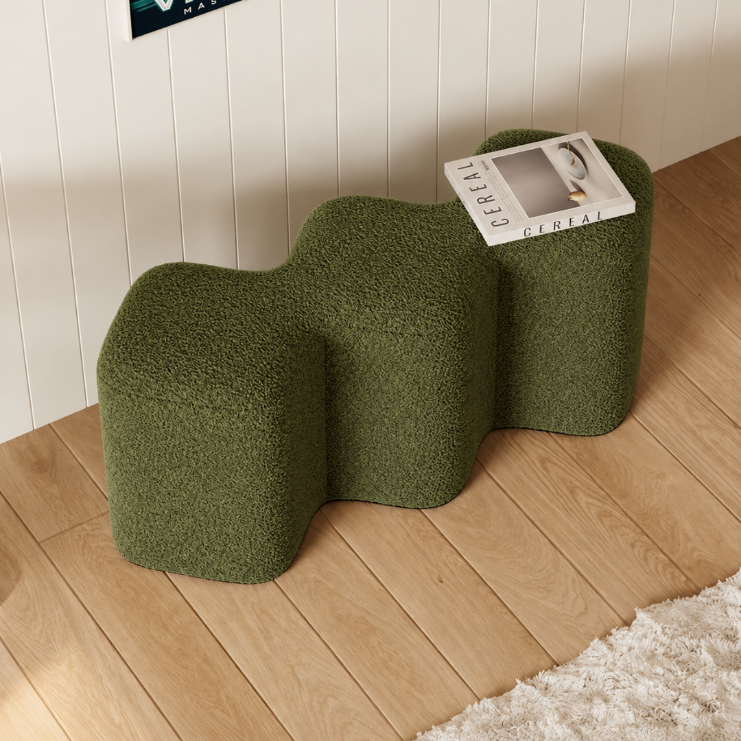 Cloud olive green wavy boucle bench with a magazine in a bright room