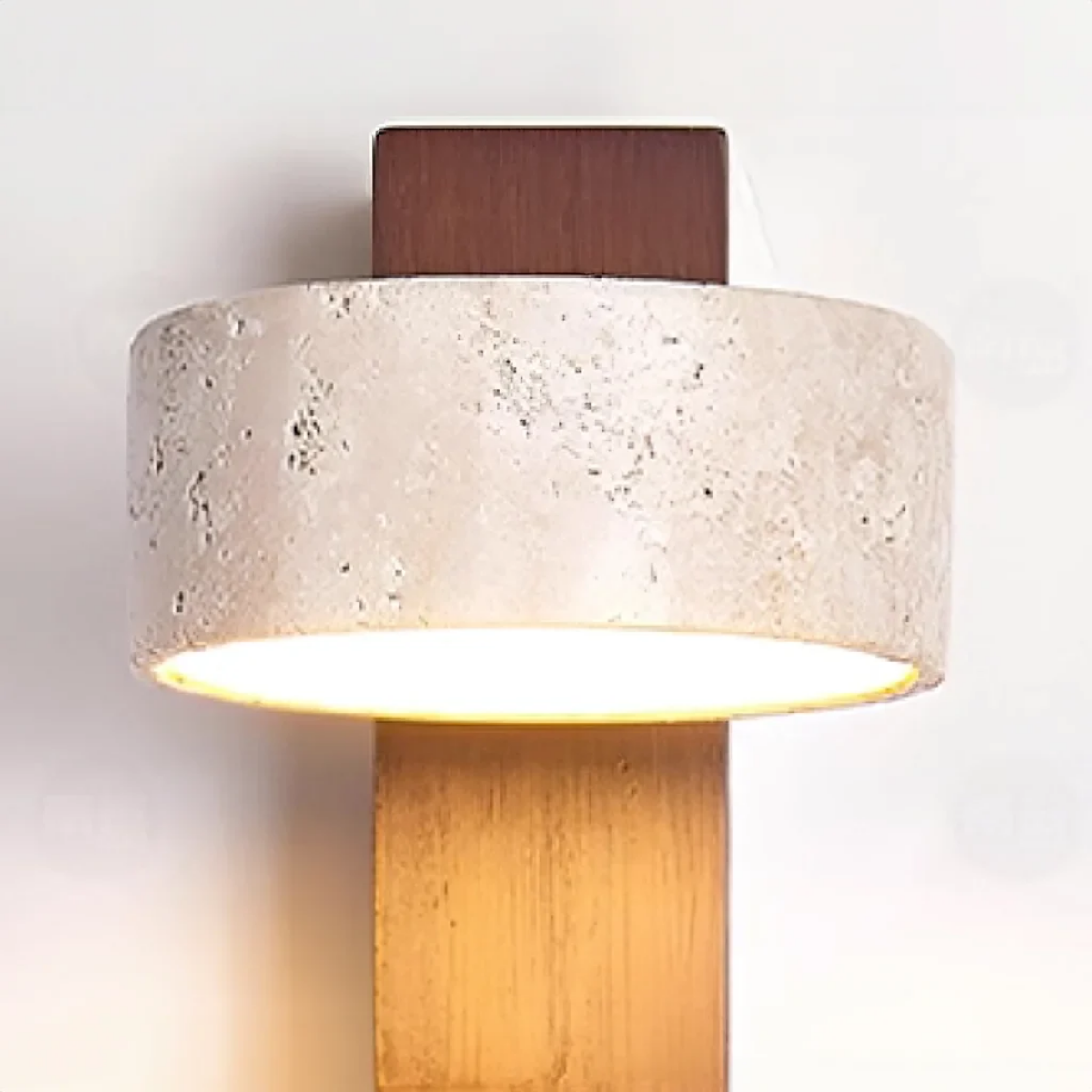 Close-up of Aurevo Travertine Rotatable Wall Lamp travertine shade lit from below