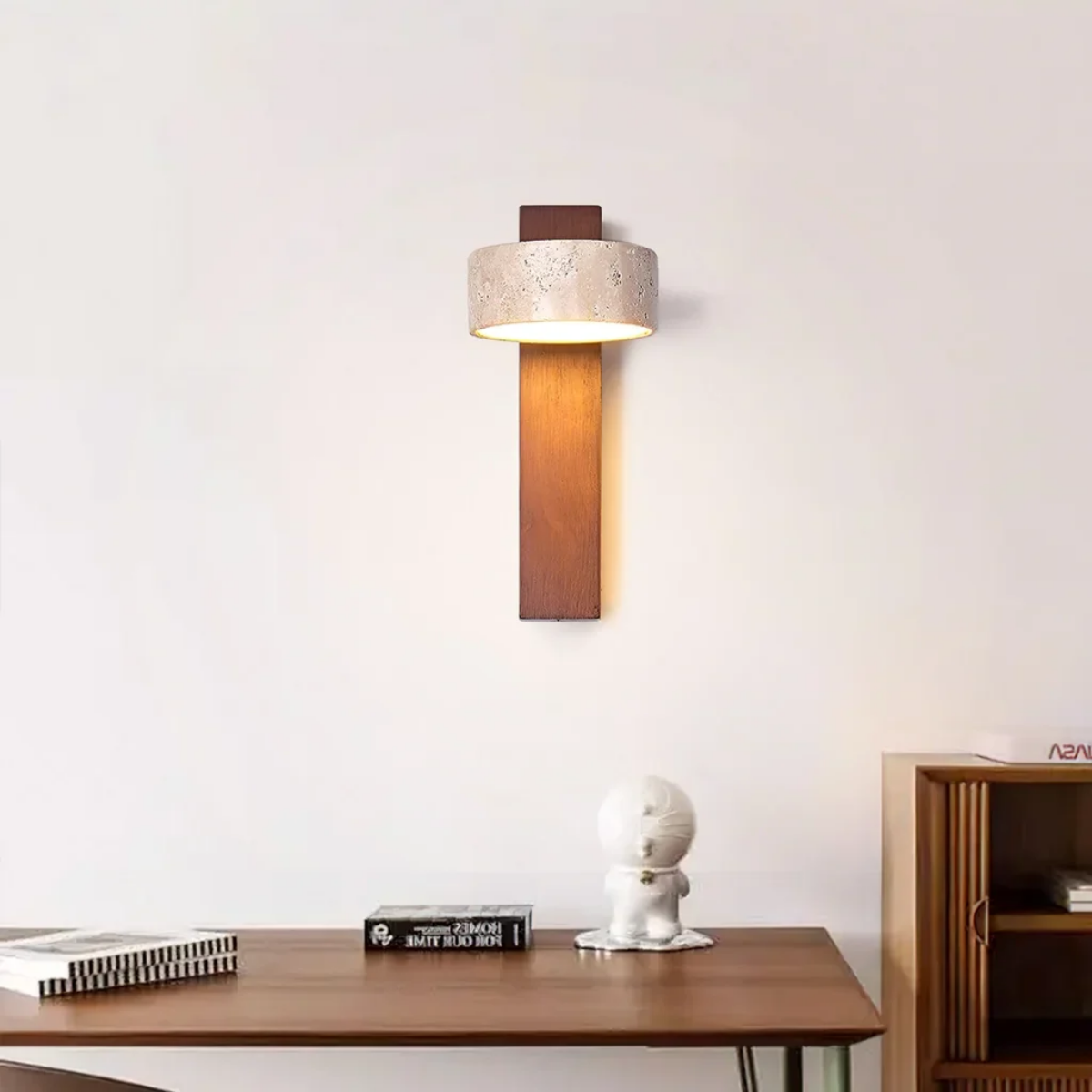 Aurevo Travertine Rotatable Wall Lamp mounted above a desk with books and decor