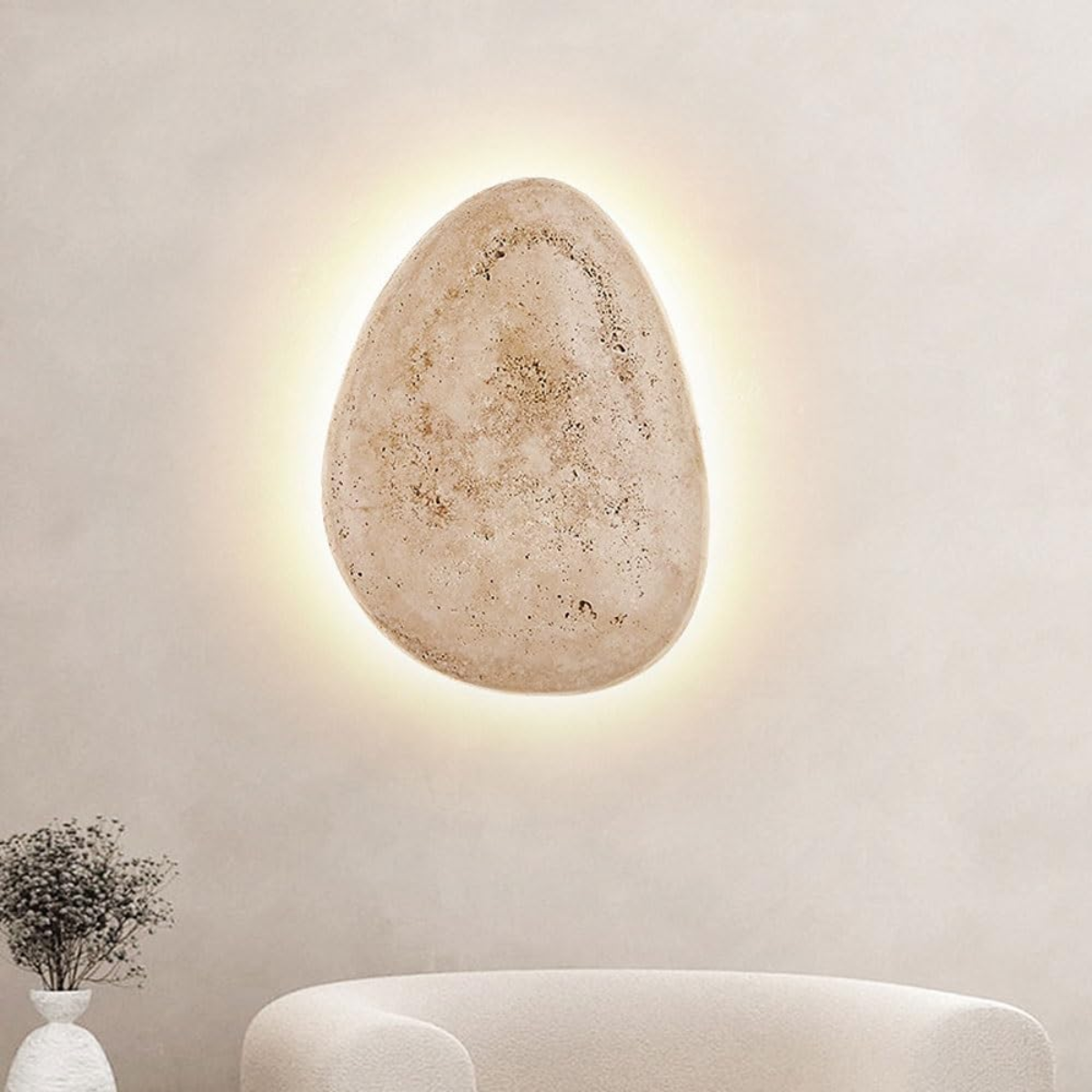 close-up front view of the pebble shape lit with warm halo glow