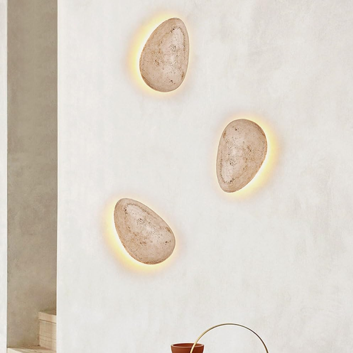 lifestyle above a bedside table with a hexagon-quilted headboard
