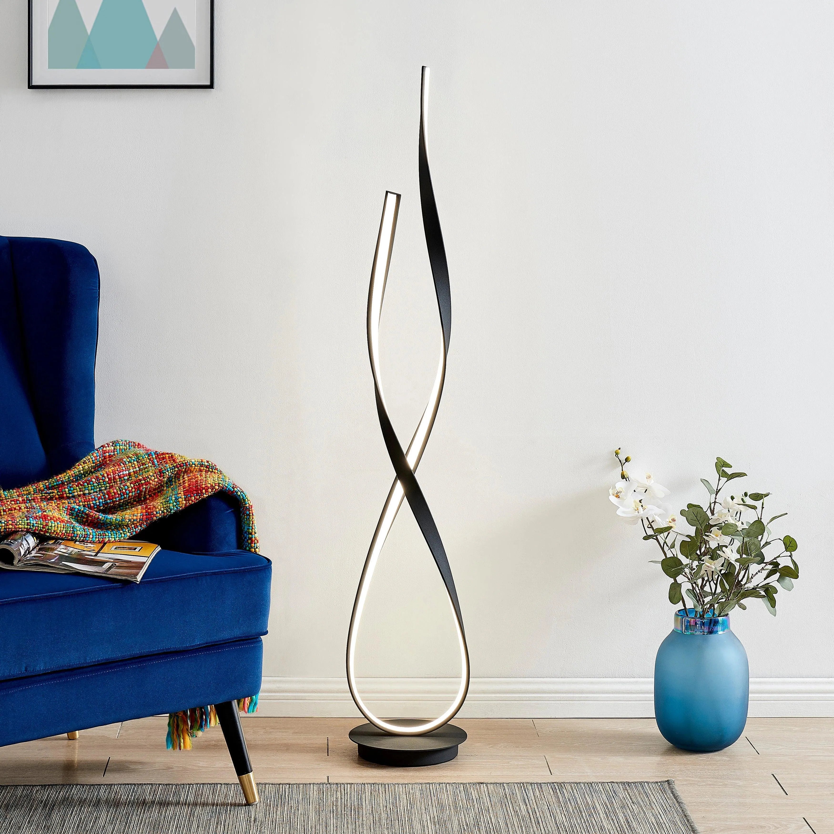 Modern standing floor lamp with a curved design