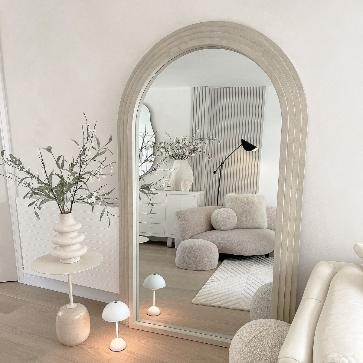 Lunara Solid Wood Arch Floor Mirror - lifestyle view in living room with sofa