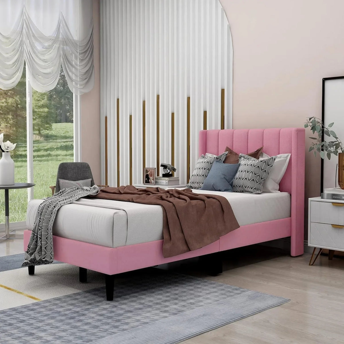 A Pink Wingback Bed That Softens the Room