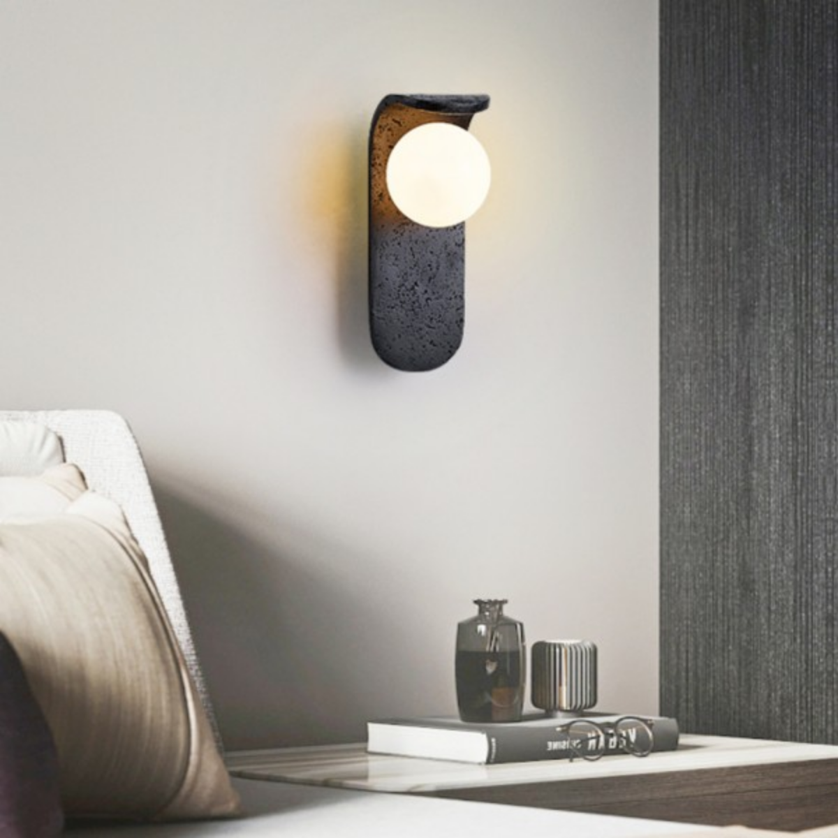 Skatera Travertine Wall Lamp installed above a bedside table in a modern bedroom