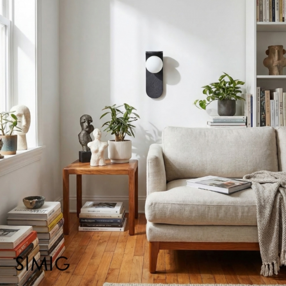 Skatera Travertine Wall Lamp installed in a living room corner with sculptural decor