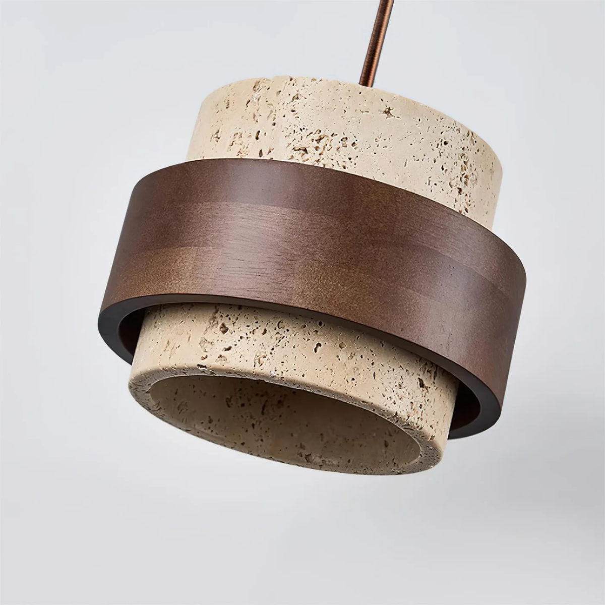 angled close-up showing travertine base interior and walnut wood band
