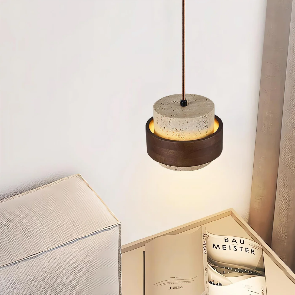 close-up above bedside table with open book and warm glow
