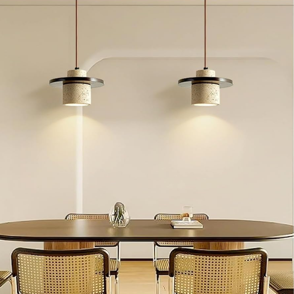 lifestyle two pendants above a dining table with rattan chairs