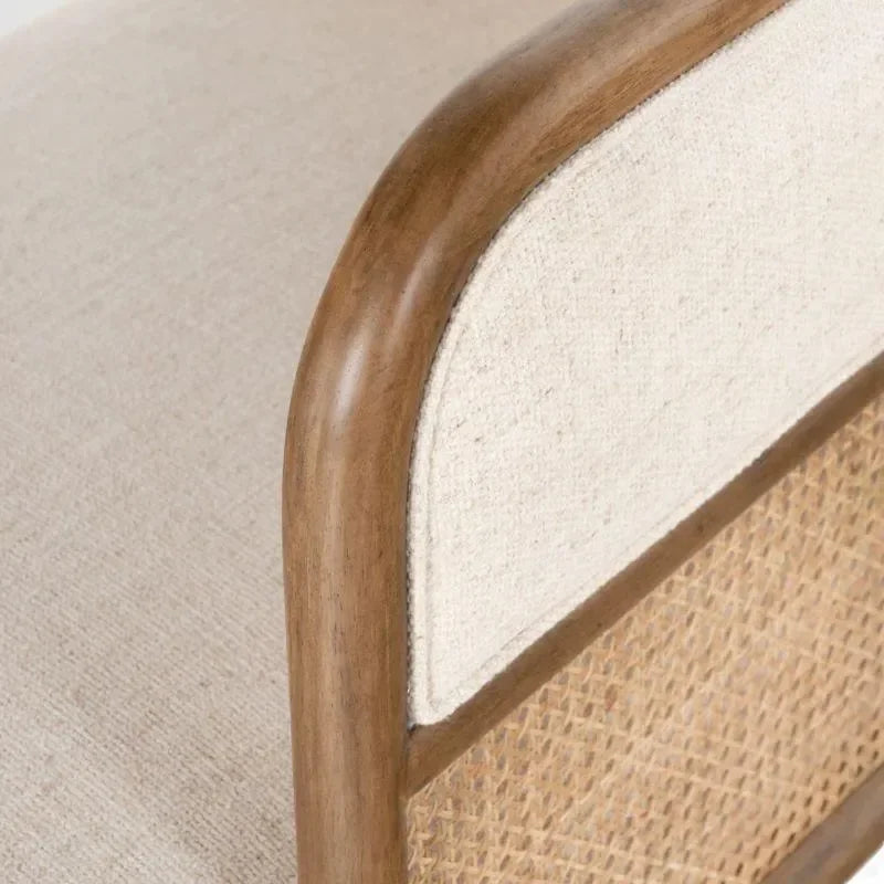 Curved Teak Framing Meets Natural Cane