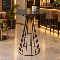 AeroCage Round Bar Table - angled view in a lounge bar setting with coffee mug