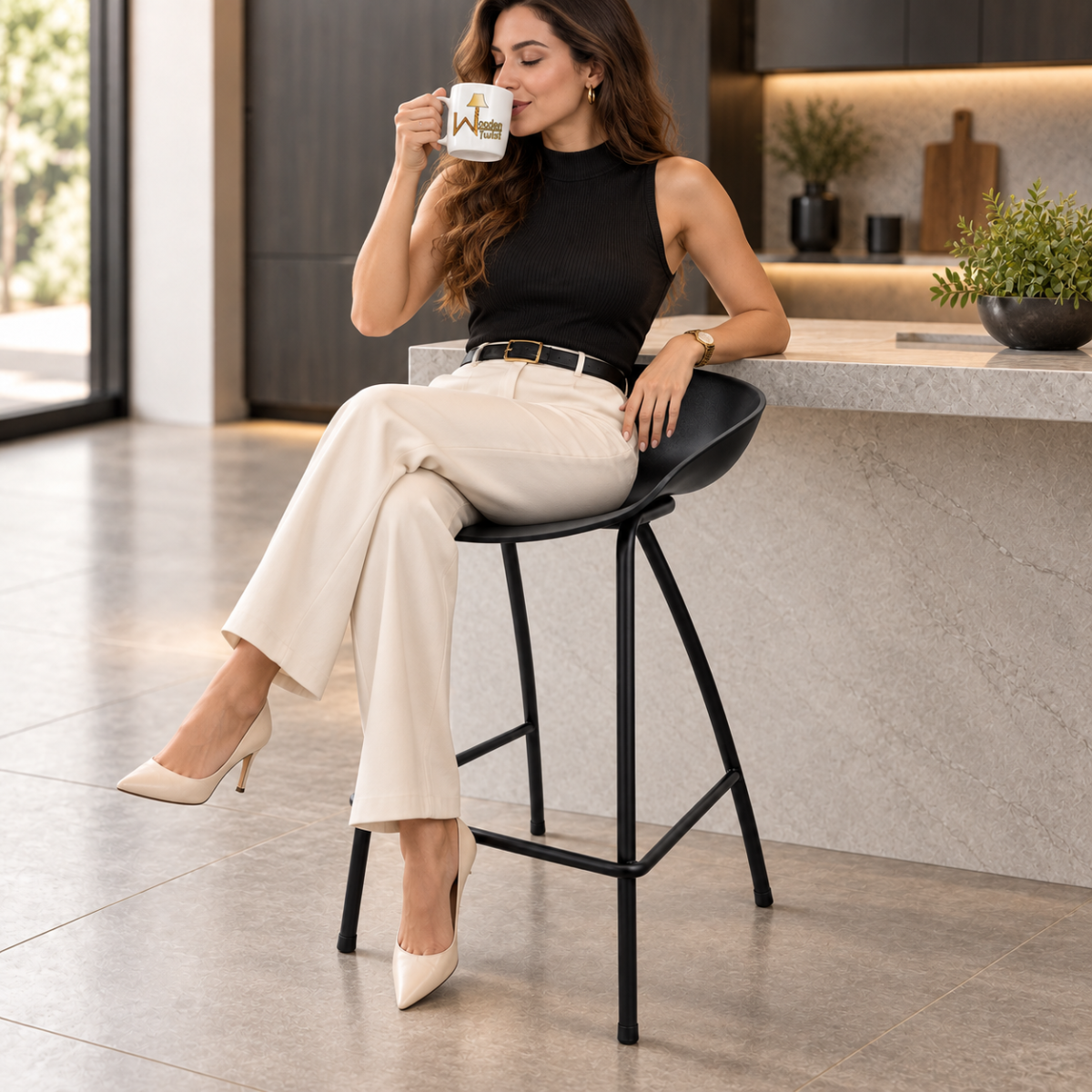 Wooden Twist NeroShell Modern Black Bar Stool with model seated at a home bar counter