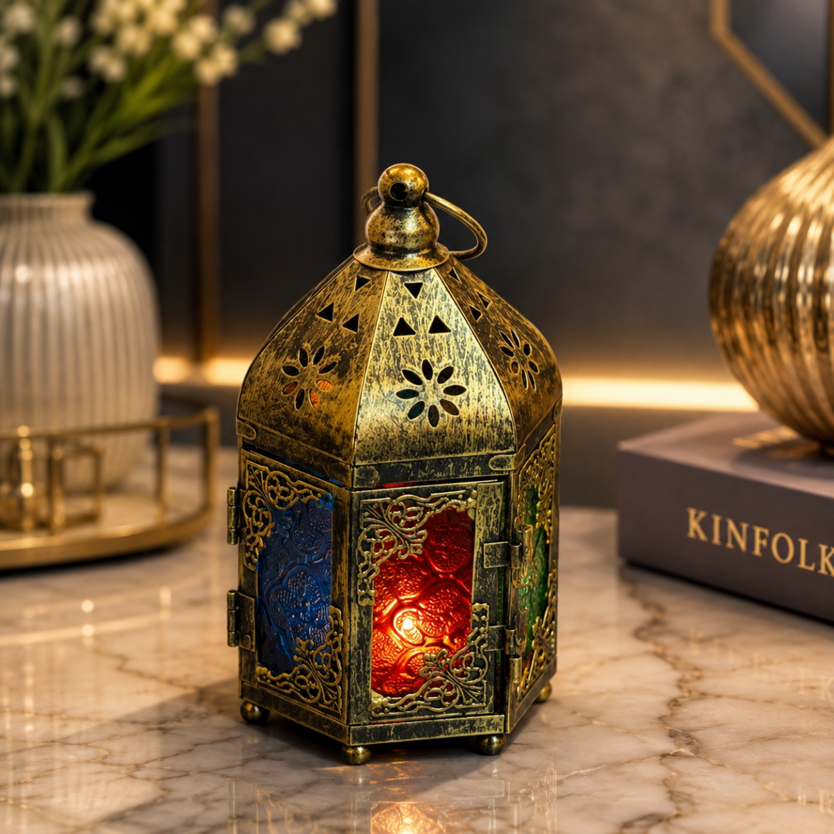 Wooden Twist Noorza Antique Brass Moroccan Lantern 20cm with Multicolor Glass Panels - lifestyle view on marble table