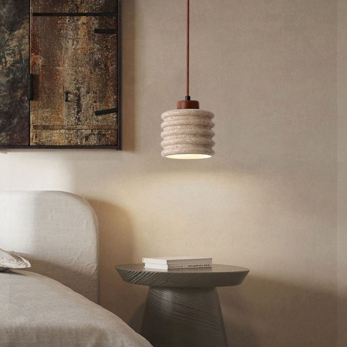 Ribelle Travertine Pendant Light - lifestyle beside a framed abstract artwork