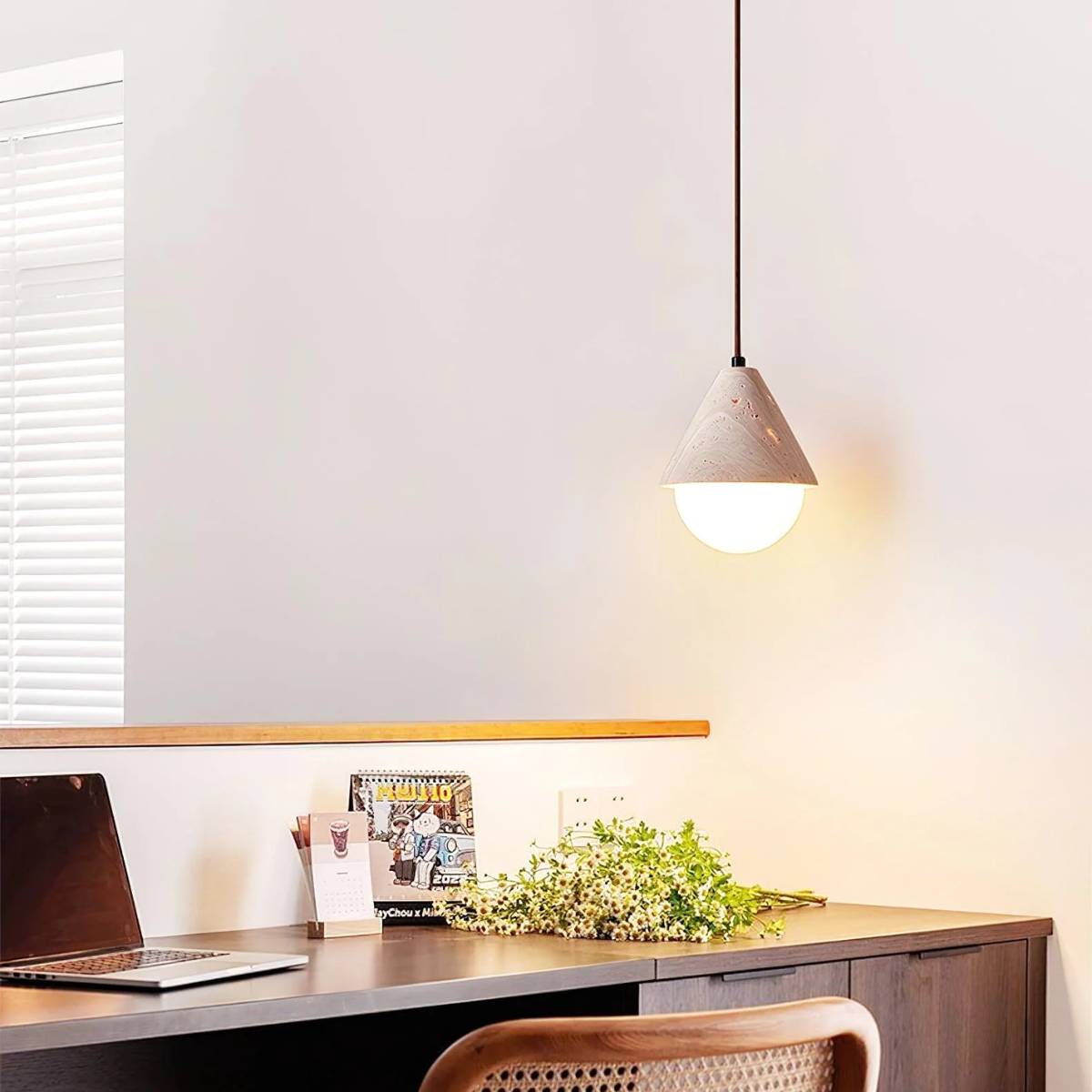 lifestyle above a home office desk with laptop and flowers