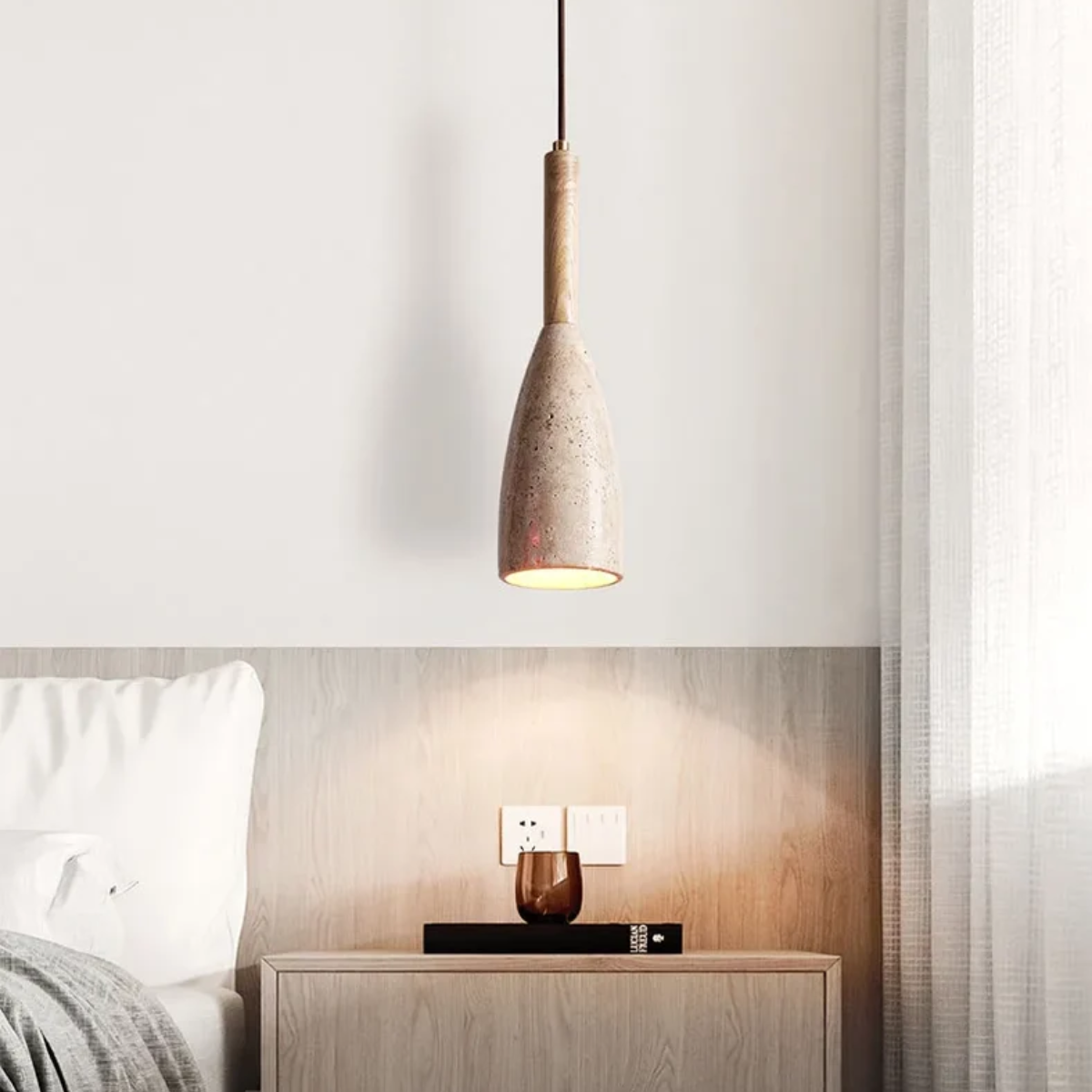 Vellora Travertine Drop Pendant Light Natural - lifestyle above a nightstand near curtains