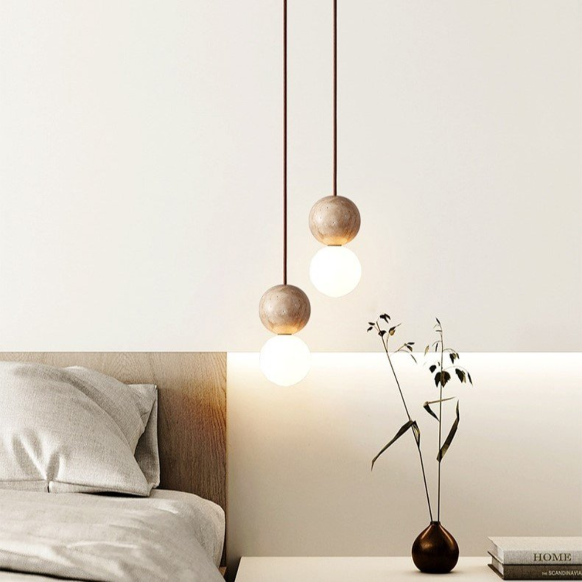 Mia Orb Pendant Light Natural - lifestyle above a bed, nightstand with plant vase
