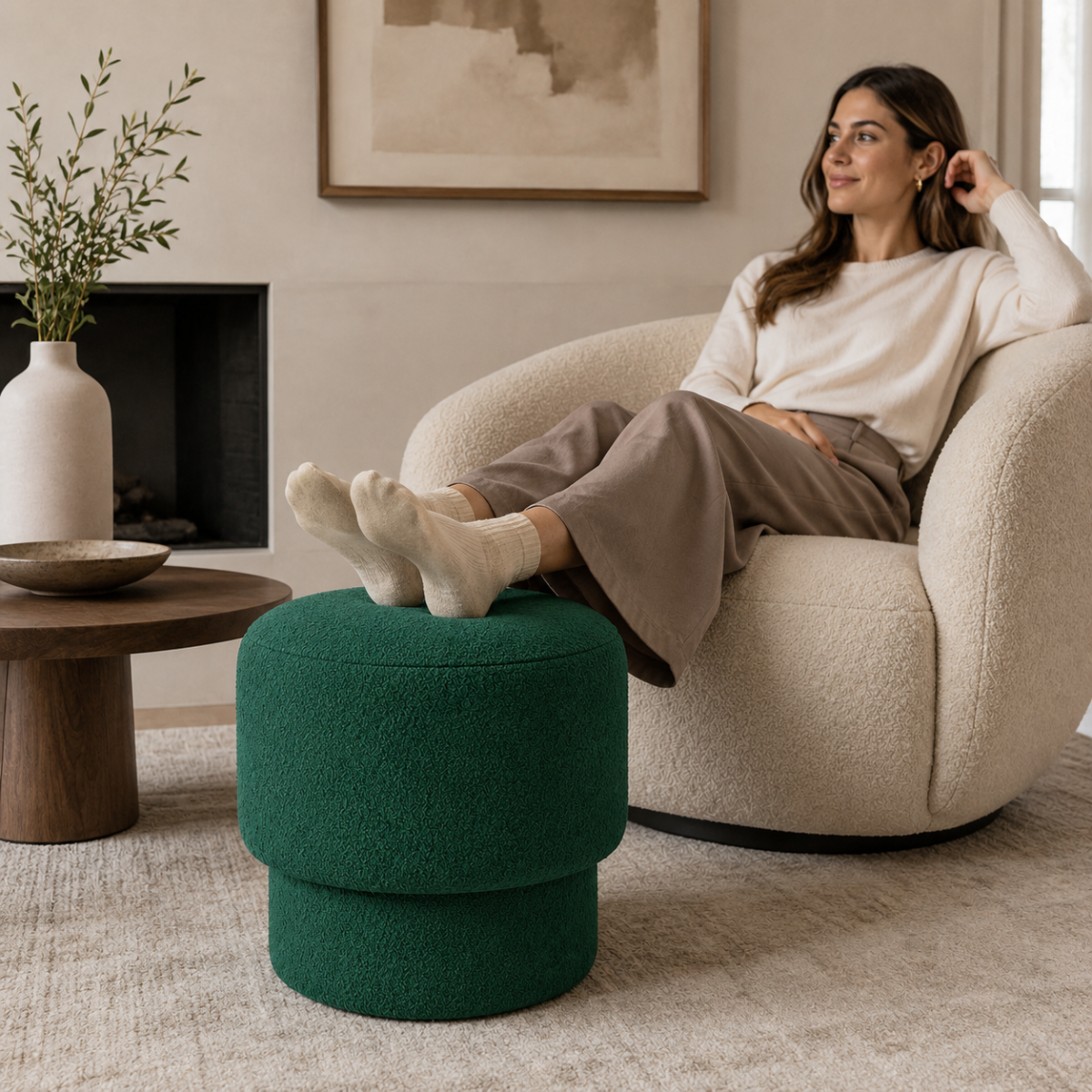 Person resting feet on Wooden Twist Mushroom Bouclé Ottoman Stool in Green – lifestyle with model